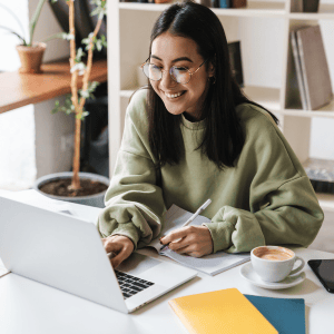 Happy woman at a computer.